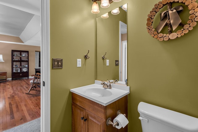 bathroom with toilet and vanity