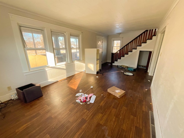 interior space with dark wood-type flooring and crown molding