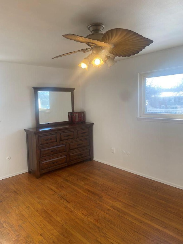 bedroom featuring wood-type flooring and ceiling fan