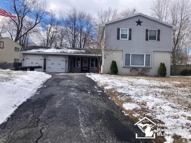 front of property with a garage