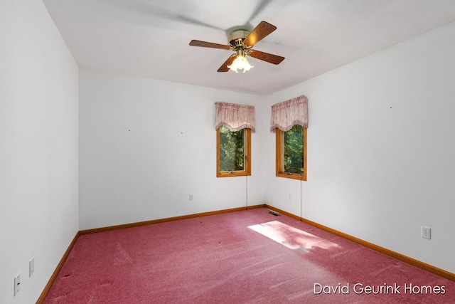 empty room featuring ceiling fan and carpet flooring