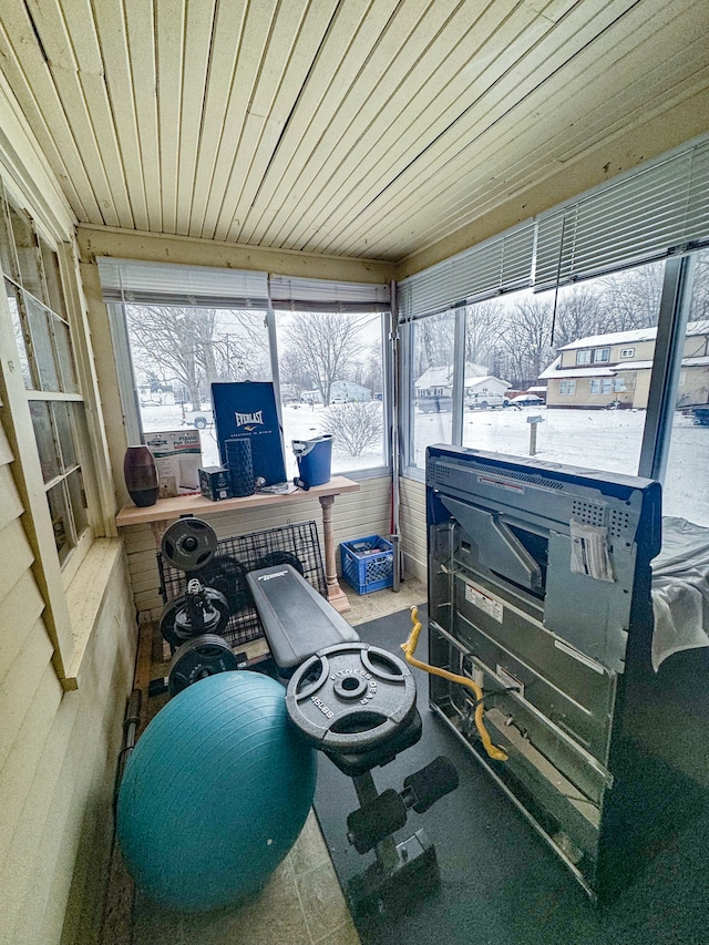 sunroom / solarium featuring wood ceiling