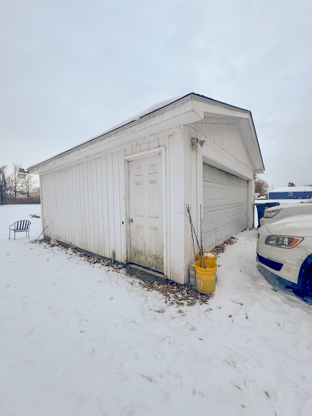 view of snow covered garage