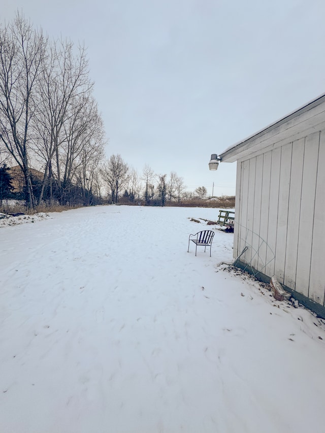 view of yard covered in snow