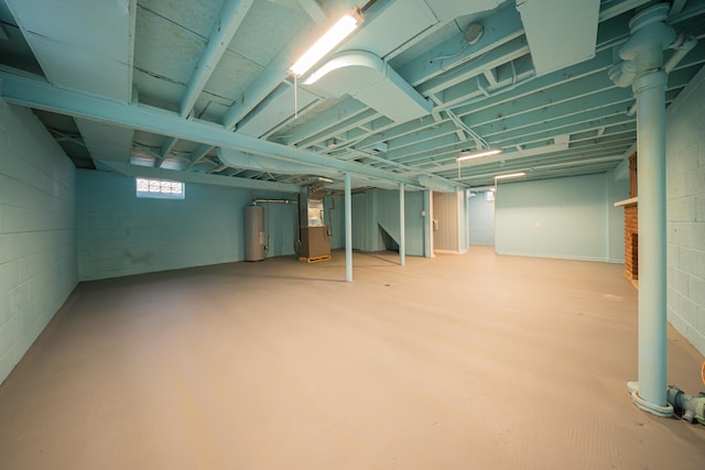 basement with water heater and heating unit