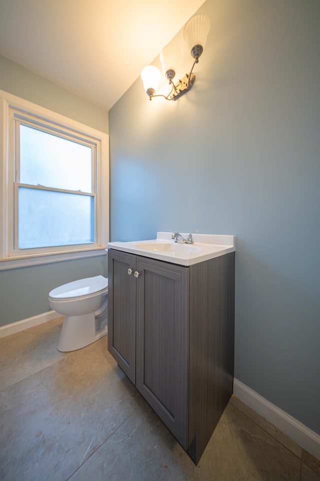 bathroom with toilet and vanity