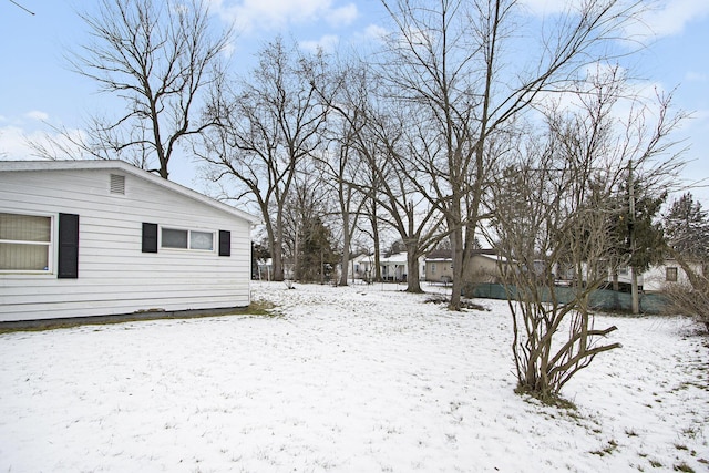 view of yard covered in snow