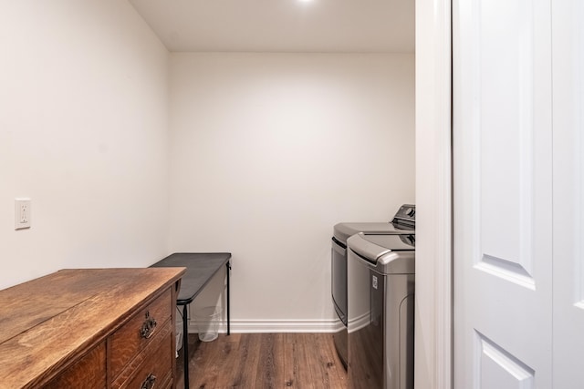 laundry room featuring separate washer and dryer and dark hardwood / wood-style floors