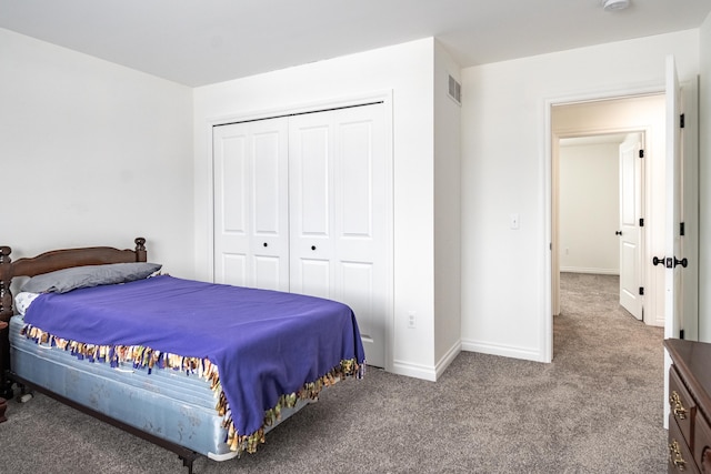 bedroom with a closet and carpet flooring