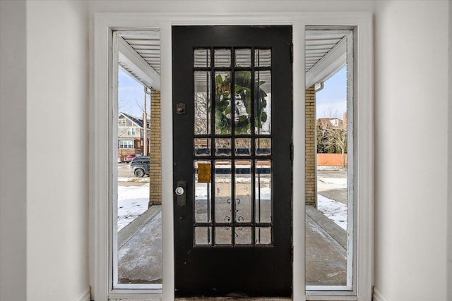 doorway to outside featuring a healthy amount of sunlight