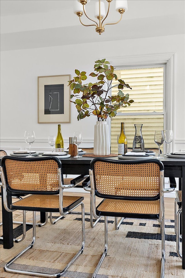 dining space with an inviting chandelier