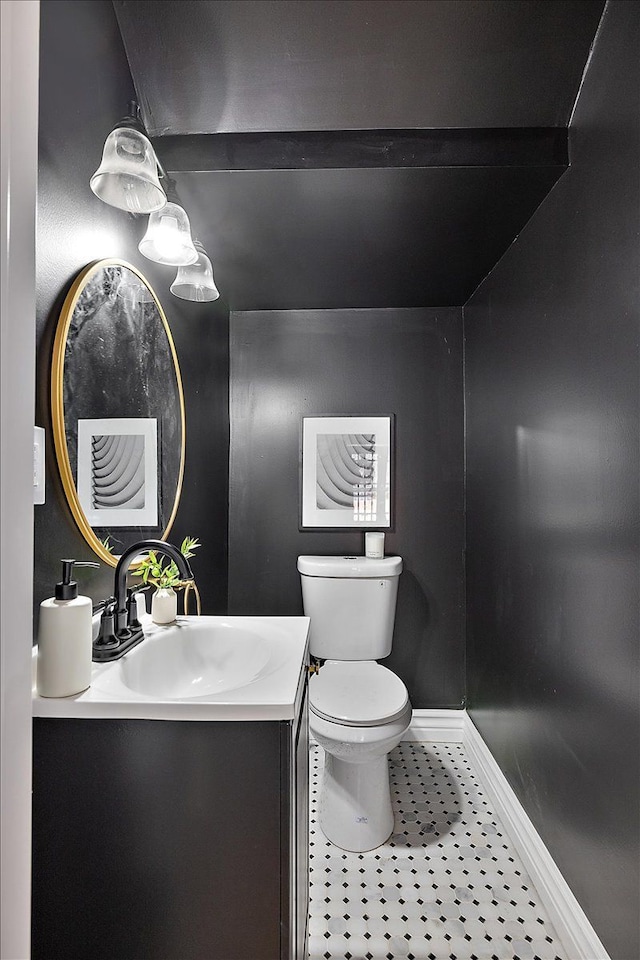 bathroom featuring vanity, toilet, and tile patterned flooring