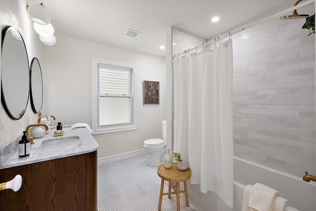 full bathroom featuring vanity, shower / bath combination with curtain, tile patterned floors, and toilet