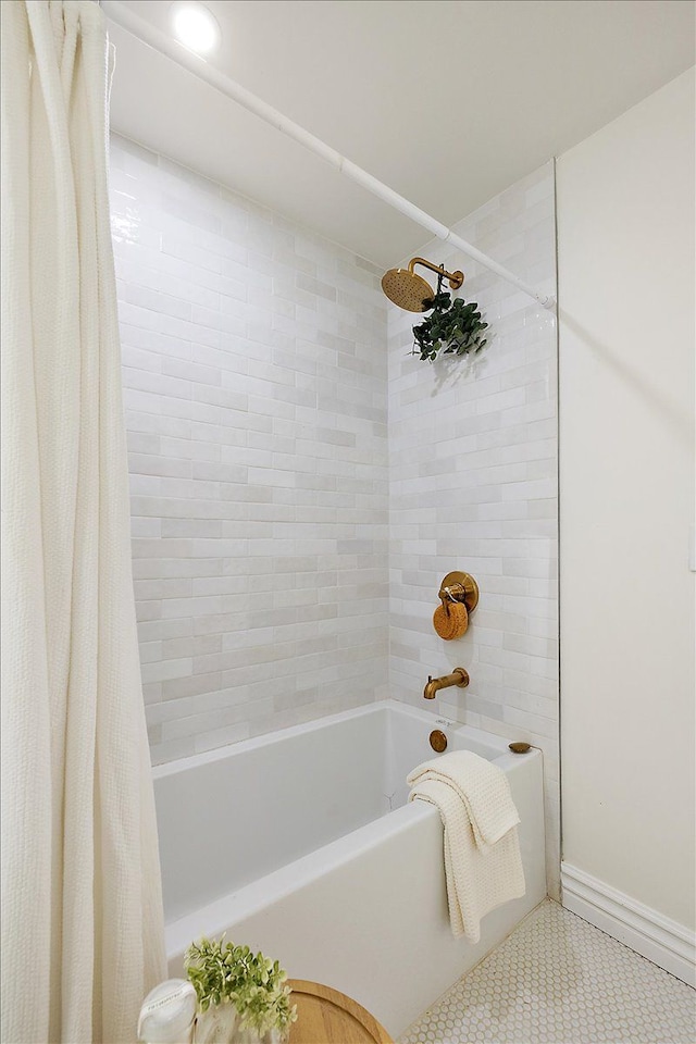 bathroom with shower / bath combination with curtain