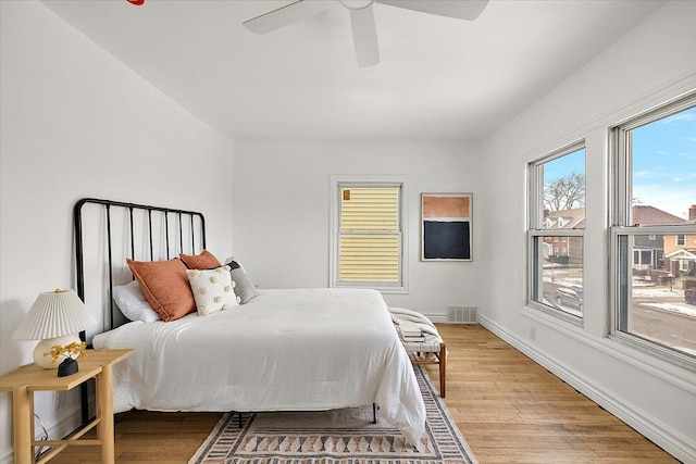 bedroom featuring ceiling fan and light wood-type flooring