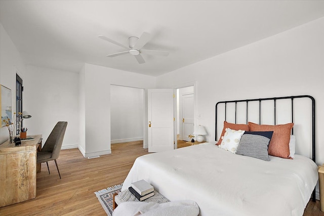 bedroom featuring hardwood / wood-style floors and ceiling fan