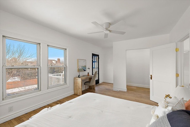 bedroom with ceiling fan and light wood-type flooring