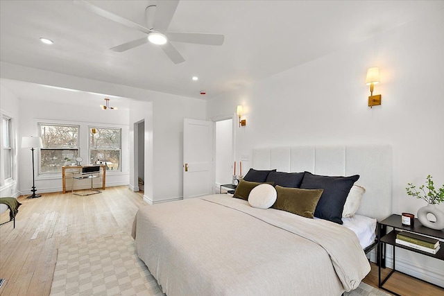 bedroom featuring ceiling fan and light hardwood / wood-style floors