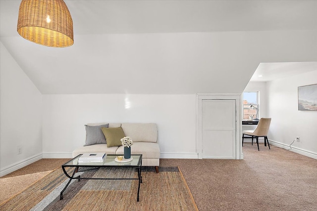 living area with vaulted ceiling and carpet flooring