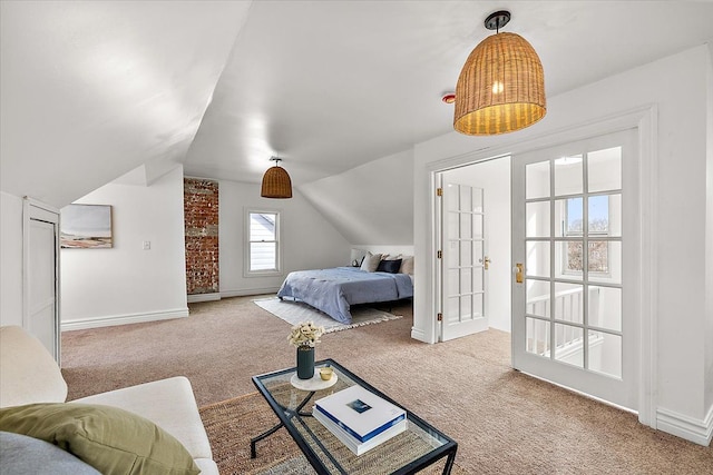 carpeted bedroom with lofted ceiling