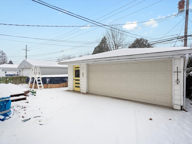 view of snow covered garage