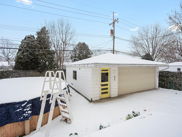 view of snow covered garage