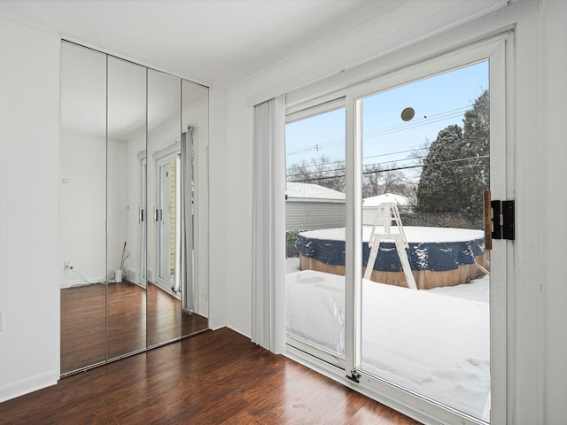 entryway with hardwood / wood-style flooring