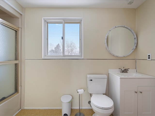 full bathroom featuring bath / shower combo with glass door, toilet, and vanity