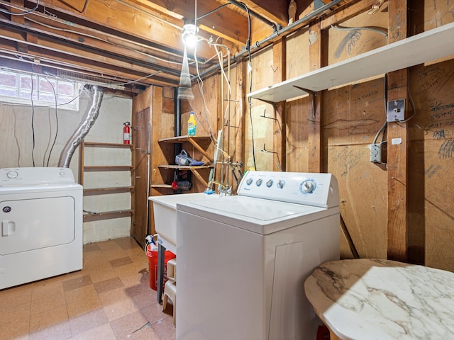 washroom featuring washer and clothes dryer