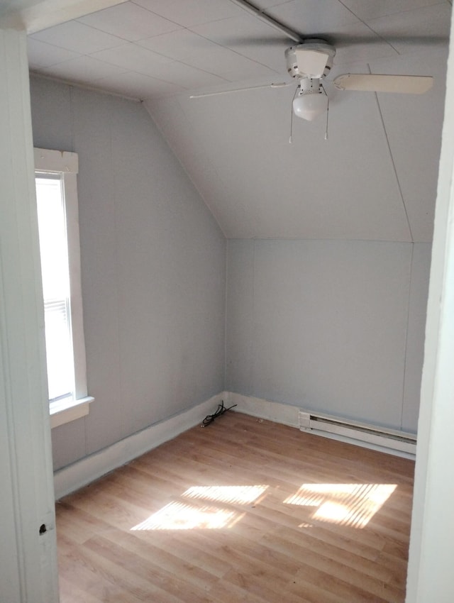 2908 Hoyt St, Muskegon Heights, MI 49444 - bonus room with lofted ceiling, baseboard heating, wood finished floors, and a ceiling fan