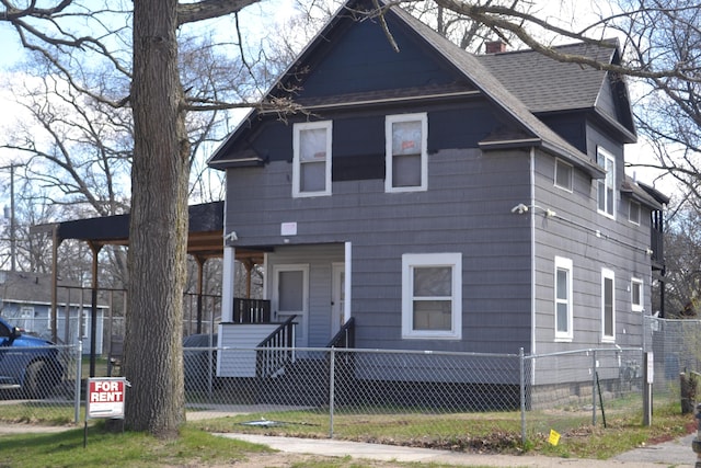 2908 Hoyt St, Muskegon Heights, MI 49444 - american foursquare style home featuring a porch, a fenced front yard, roof with shingles, and a chimney
