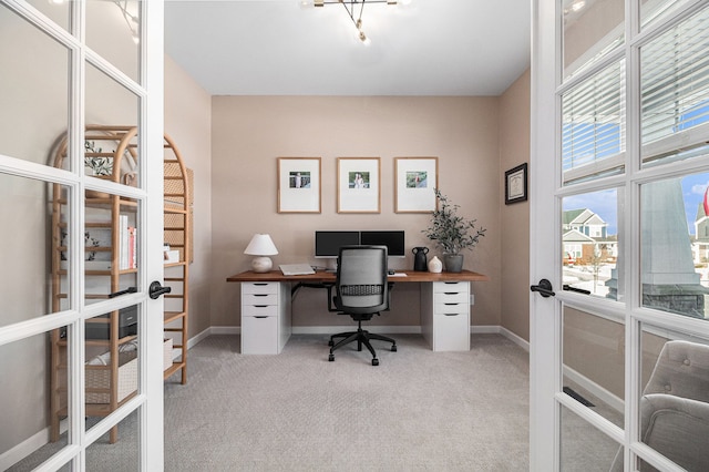 carpeted office featuring french doors