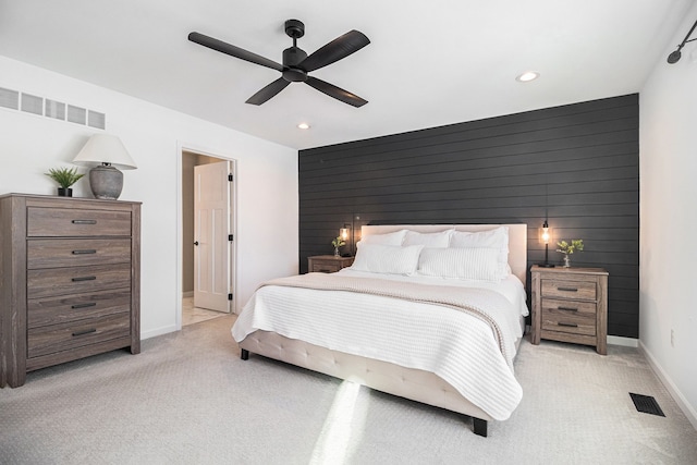 bedroom featuring ceiling fan and light colored carpet