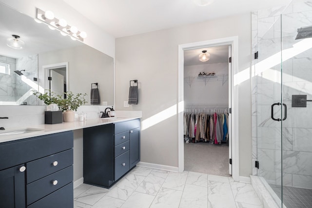 bathroom with vanity and a shower with door