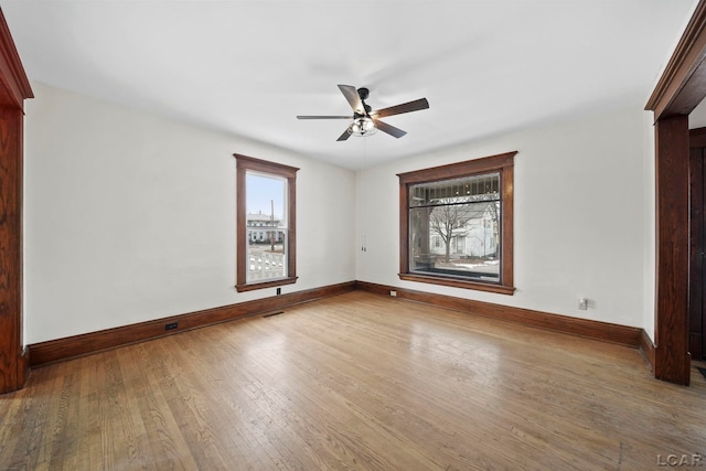 empty room featuring ceiling fan and wood-type flooring