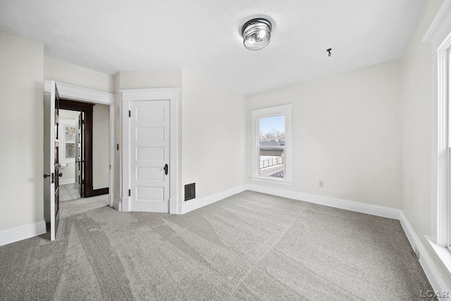 empty room featuring carpet flooring