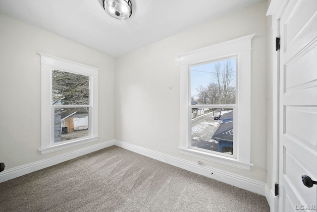 spare room featuring carpet floors