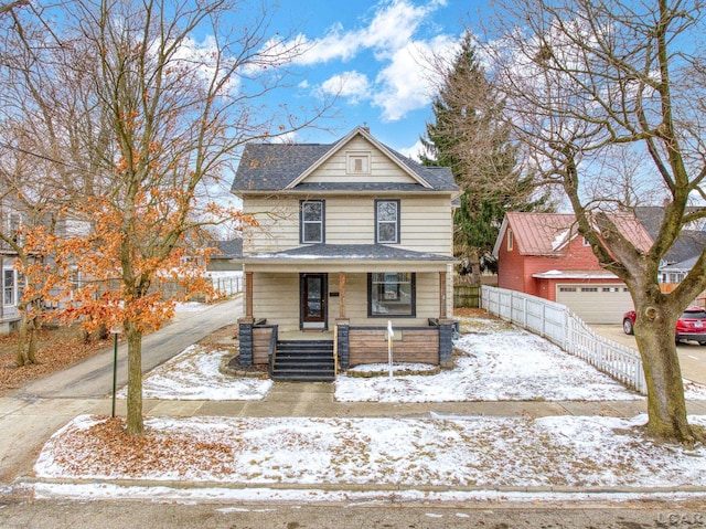 front facade with a garage and a porch