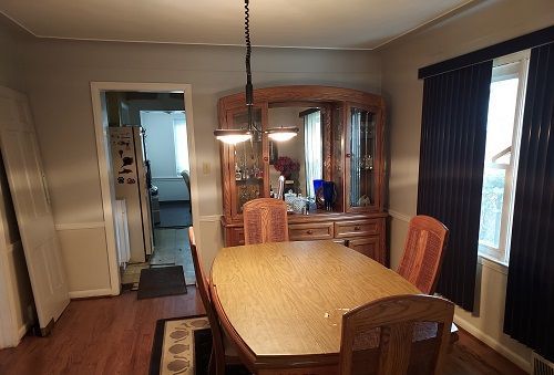 16146 Chapel St, Detroit, MI 48219 - dining area with dark wood-style floors and arched walkways
