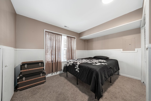 bedroom featuring light carpet