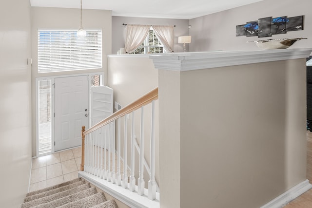 foyer entrance with light tile patterned floors