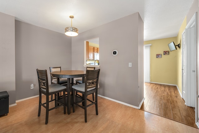 dining area featuring light hardwood / wood-style flooring