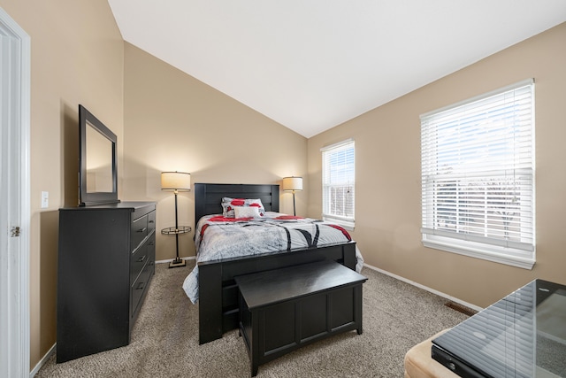 carpeted bedroom featuring lofted ceiling