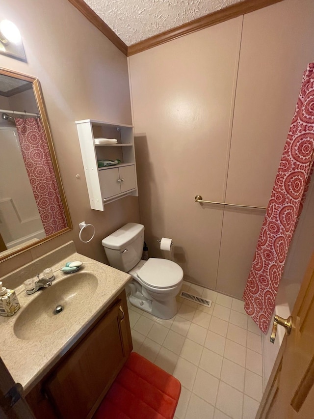 bathroom with tile patterned floors, toilet, a textured ceiling, ornamental molding, and vanity