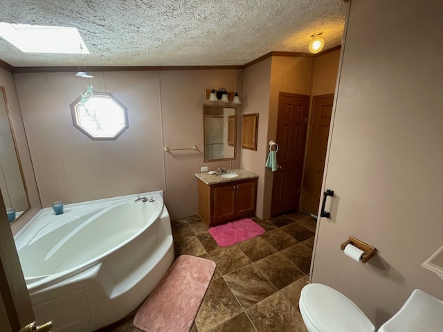 772 Hawick Cir, Mount Morris, MI 48458 - bathroom featuring a garden tub, vanity, toilet, and a textured ceiling