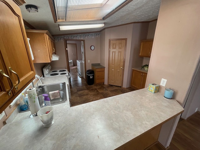 772 Hawick Cir, Mount Morris, MI 48458 - kitchen with a sink, white electric range oven, a peninsula, brown cabinets, and ornamental molding