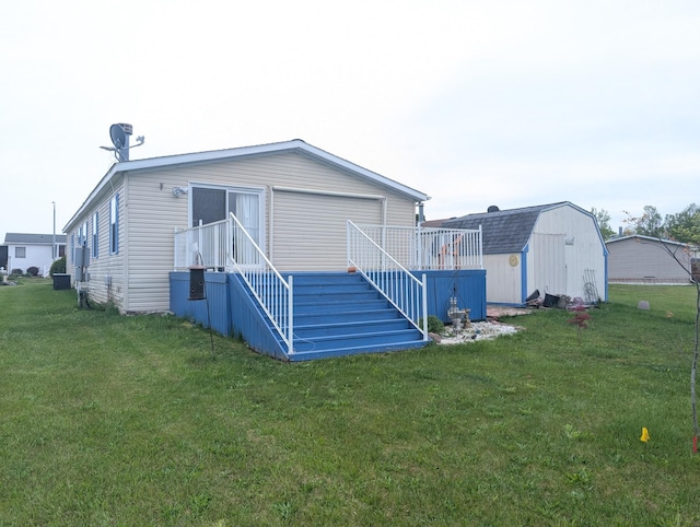 772 Hawick Cir, Mount Morris, MI 48458 - rear view of property featuring stairs and a lawn