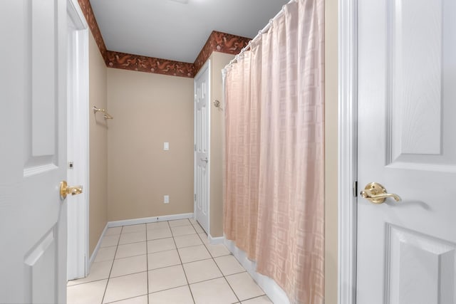 310 Sycamore St, Litchfield, MI 49252 - full bathroom featuring baseboards and tile patterned flooring