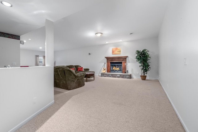 310 Sycamore St, Litchfield, MI 49252 - sitting room featuring baseboards, carpet flooring, a glass covered fireplace, and recessed lighting
