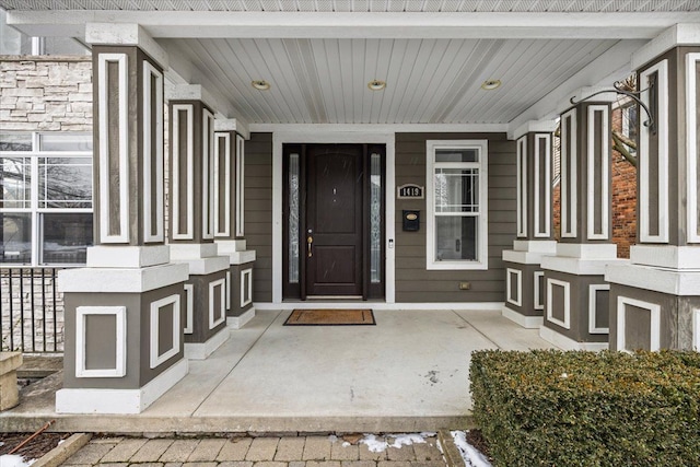 property entrance with covered porch